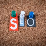 SEO Concept. Letters pinned to a cork notice board.