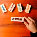 Content Concept. Woman holding wood block.